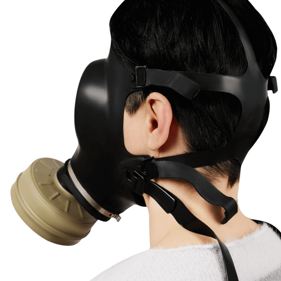 Side view of Israeli CBRN gas mask showing adjustable elastic straps and secure head fit