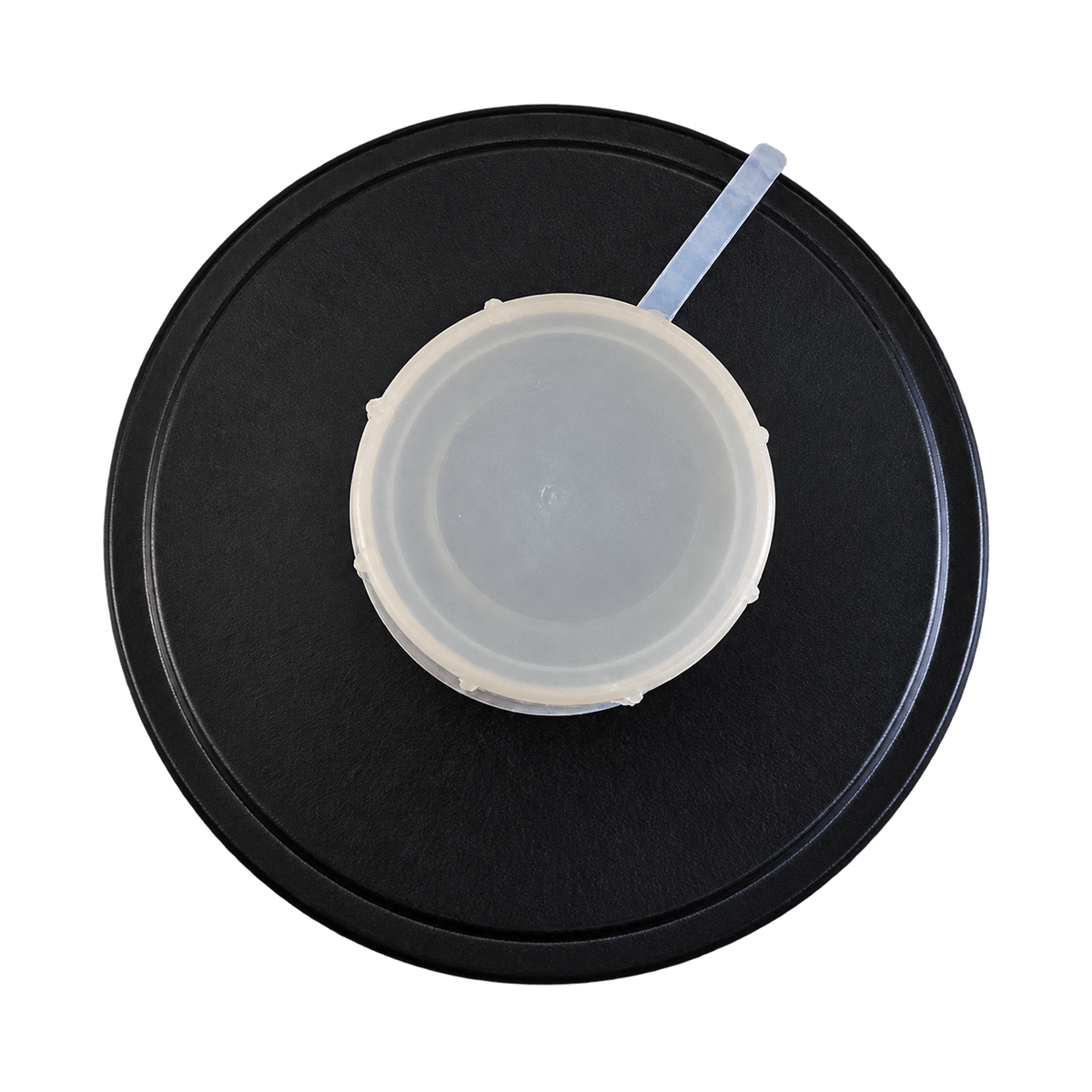 Close-up of a protective seal cap with pull tab on a 40mm CBRN filter