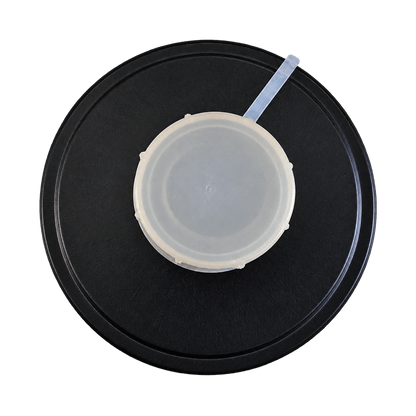 Close-up of a protective seal cap with pull tab on a 40mm CBRN filter