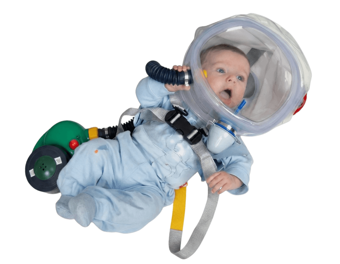 Infant wearing full CBRN PAPR escape hood kit - transparent hood, blower, harness and 40mm NATO NBC filter for babies