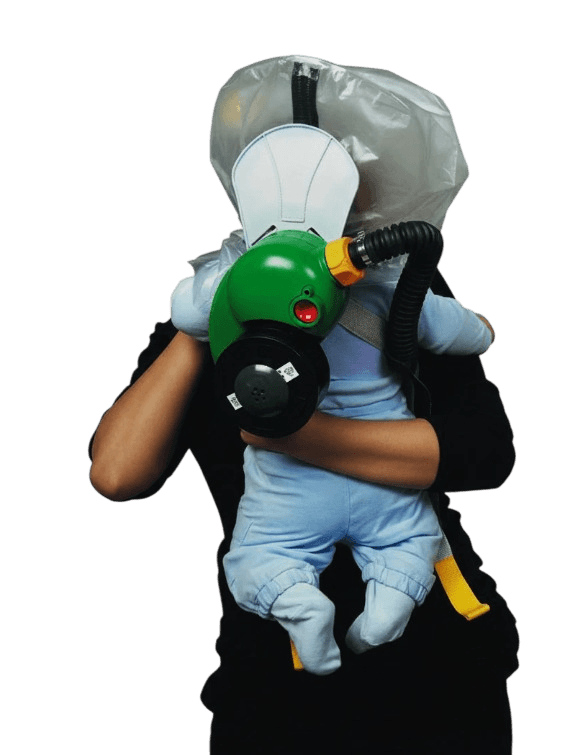 Parent carrying infant in CBRN PAPR escape hood - Onyx 45 blower, 40mm NATO NBC filter and back carry harness visible
