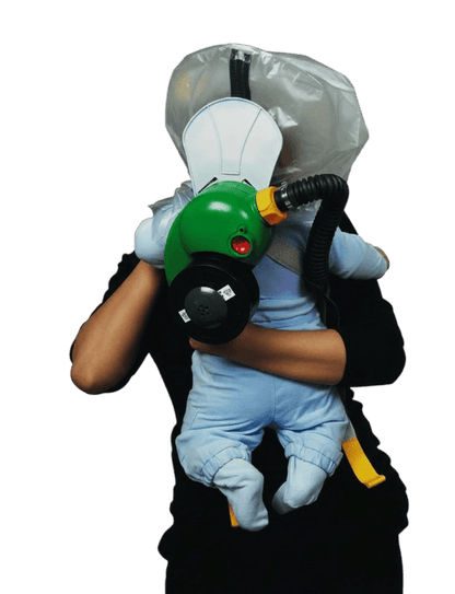 Parent carrying infant in CBRN PAPR escape hood - Onyx 45 blower, 40mm NATO NBC filter and back carry harness visible